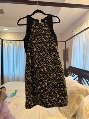 Sleeveless Black Mini Dress with Yellow Floral Pattern